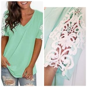 New pastel blue Size L T shirt with lace on sleeves